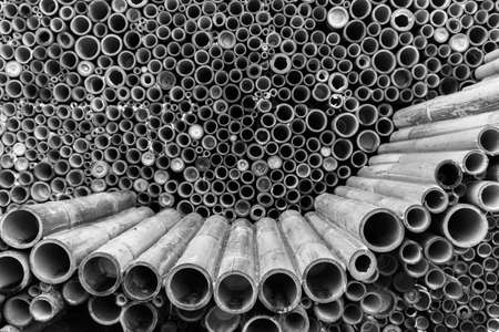 Pile of bamboo pole used in construction industry, bamboo wall textured backgroundの写真素材