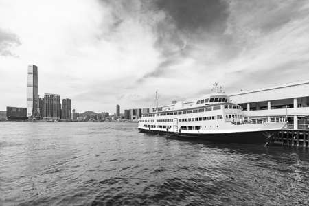 Ferry pier and skyline in Victoria harbor in Hong Kong cityの写真素材