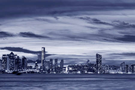 Panorama of Victoria harbor of Hong Kong city at duskの写真素材
