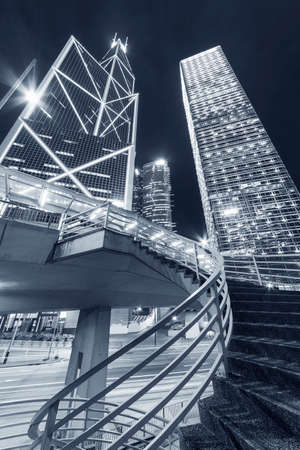High rise office buildings in Central district of Hong Kong city at nightの写真素材