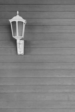 Street light on wooden wallの写真素材