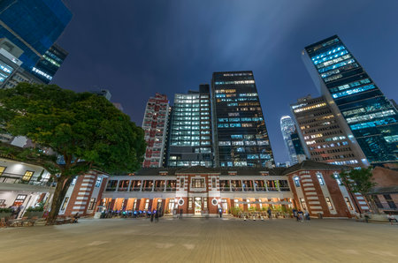 Night scenery of old and modern high rise buildings in Hong Kong cityのeditorial素材