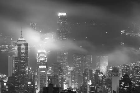 Misty night view of Victoria harbor in Hong Kong cityの写真素材