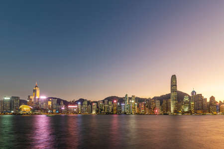 Victoria harbor of Hong Kong city at duskの写真素材