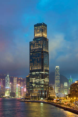 Skyline and harbor of Hong Kong city at dusk