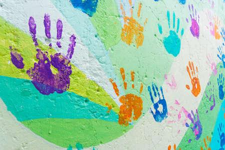 background made from color handprints of kids. Multicolor pattern for your design.の写真素材