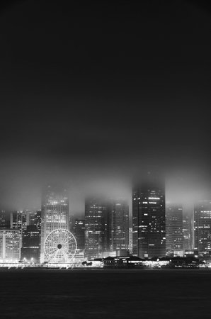 Victoria harbor of Hong Kong city in fogの写真素材