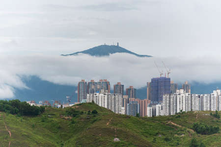 Mountain Tai Mo Shan and skyline of Yuen Long district in Hong Kong cityの写真素材