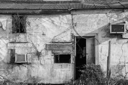Exterior of abandoned house in black and whiteの写真素材