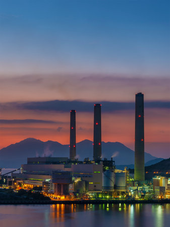 Power plant in Hong Kong city at duskのeditorial素材