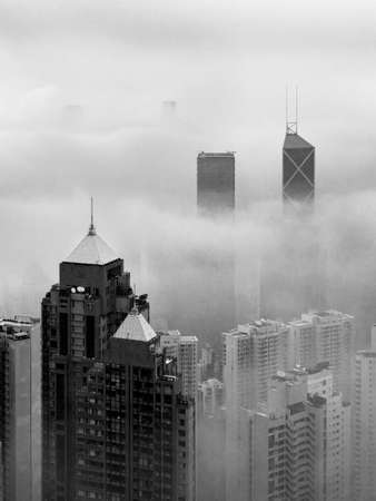 Skyscraper in downtown of Hong Kong city in fogの写真素材