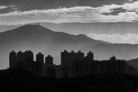 silhouette city skyline and mountain. landscape of Hong Kong at dawnの写真素材