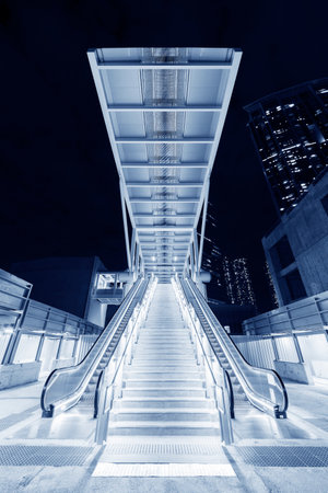 Night scenery of modern escalator in downtown district of Hong Kong cityの写真素材