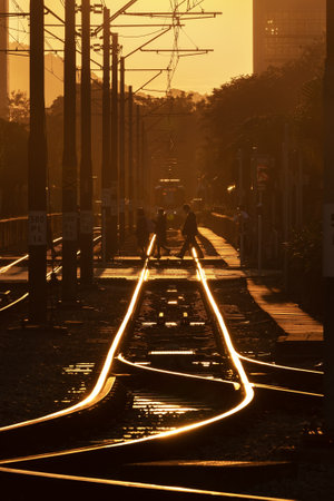 Hong Kong, China - December 19 2022: Level crossing for pedestrian across Light rail transit. LRT is a light rail system operated by MTR Corporation, serving Tuen Mun, Yuen Long and Tin Shu Waiのeditorial素材