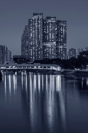 High rise residential building in Hong Kong city at nightの写真素材