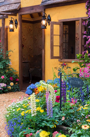 Landscaped backyard of house with flower gardenの写真素材