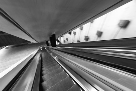 Interior view of downward escalator. Building abstract backgroundの写真素材