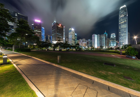 Public park and skyline in downtown district of Hong Kong city at night
