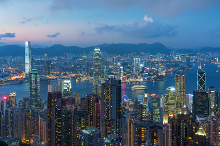 Victoria harbor of Hong Kong City at duskの写真素材