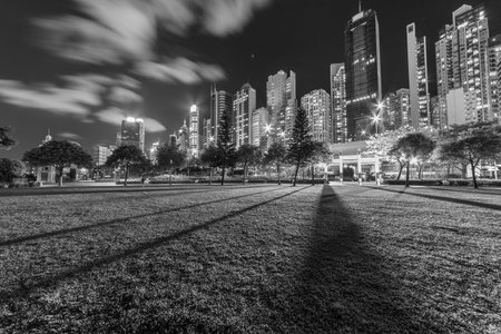 High rise office building and public park in downtown of Hong Kong city at nightの写真素材