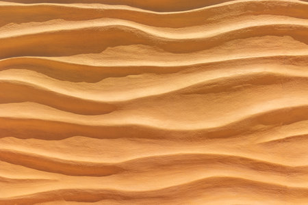 Background and texture of sand in wave patternの写真素材