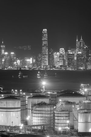 Oil tank in Victoria harbor of Hong Kong city at nightの写真素材