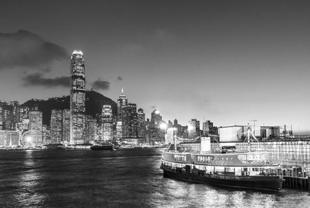Victoria Harbor of Hong Kong city at duskの写真素材