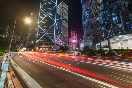 traffic in central district of Hong Kong city at nightの写真素材