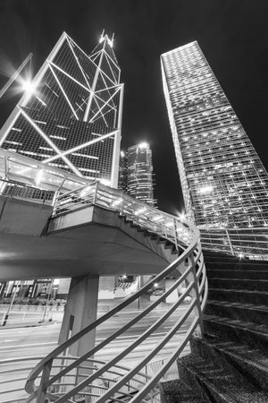 High rise office buildings in Central district of Hong Kong city at nightの写真素材