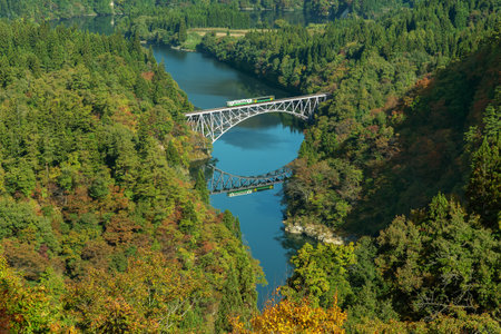Idyllic landscape of Tadami Sen, Tadami Railway Line and Bridge Reflection in Mishima Machi, Aizu,...