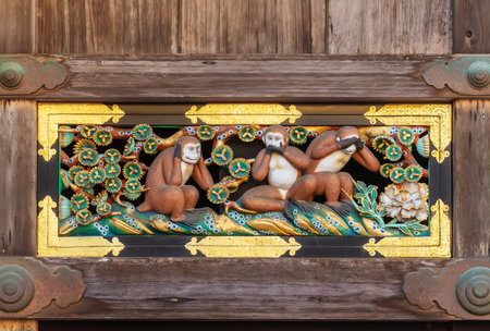 Wood carving depicting three wise monkeys at Toshogu shrine in Nikko, Japanのeditorial素材