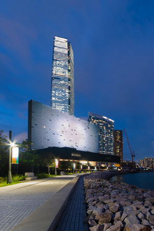 Night scenery of West Kowloon Cultural District and Victoria harbor in Hong Kong cityのeditorial素材