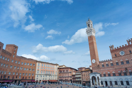 SIENA, ITALY - MAY 11 : Tourists in Piazza del Campo, May 11, 2014 in Siena, Italy. The historic centre of Siena has been declared by UNESCO a World Heritage Site.のeditorial素材