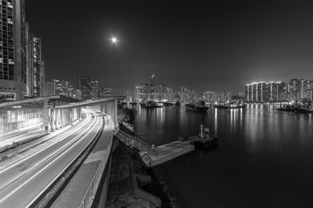 Night scenery of skyline and highway in Hong Kong cityの写真素材