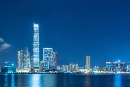 Panorama of skyline of Victoria harbor of Hong Kong city at nightの写真素材
