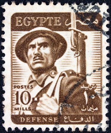 EGYPT - CIRCA 1953  A stamp printed in Egypt shows a soldier, circa 1953  の写真素材