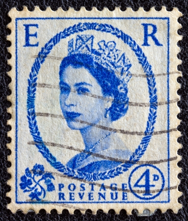 UNITED KINGDOM - CIRCA 1952: A postage stamp printed in United Kingdom shows a portrait of queen Elizabeth II, circa 1952. のeditorial素材