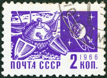 USSR - CIRCA 1966: A stamp printed in USSR from the "Society and Technology" issue shows Luna 9 space mission and the Moon, circa 1966.のeditorial素材