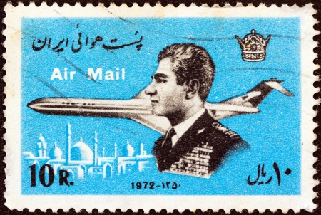 IRAN - CIRCA 1972: A stamp printed in Iran shows Mohammad Reza Shah Pahlavi and airplane, circa 1972.のeditorial素材