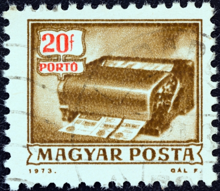 HUNGARY - CIRCA 1973: A stamp printed in Hungary from the "Postal Operations" issue shows a money-order cancelling machine, circa 1973. のeditorial素材