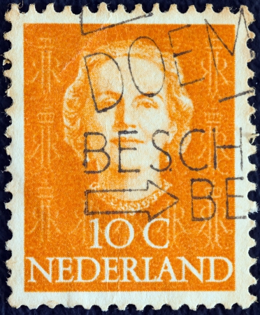 NETHERLANDS - CIRCA 1949: A stamp printed in the Netherlands shows Queen Juliana, circa 1949. のeditorial素材