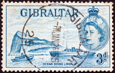 GIBRALTAR - CIRCA 1953: A stamp printed in Gibraltar shows Ocean liner, Gibraltar and Queen Elizabeth II, circa 1953. のeditorial素材