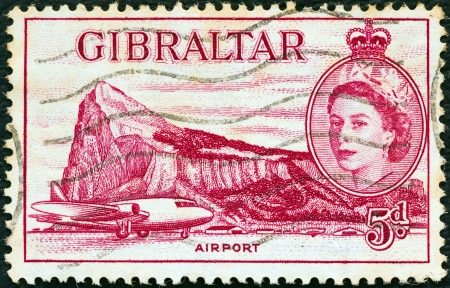 GIBRALTAR - CIRCA 1953: A stamp printed in Gibraltar shows Airport, Gibraltar and Queen Elizabeth II, circa 1953. のeditorial素材