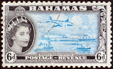 BAHAMAS - CIRCA 1954: A stamp printed in the Bahamas shows Modern transportation and Queen Elizabeth II, circa 1954. のeditorial素材