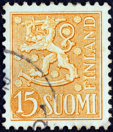 FINLAND - CIRCA 1954: A stamp printed in Finland shows National arms emblem, circa 1954. のeditorial素材