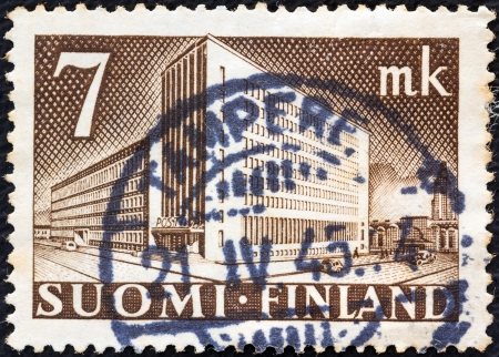 FINLAND - CIRCA 1942: A stamp printed in Finland shows Main Post Office, Helsinki, circa 1942. のeditorial素材
