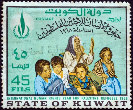 KUWAIT - CIRCA 1968: A stamp printed in Kuwait from the "International Human Rights Year" issue shows Palestine Refugees, circa 1968.のeditorial素材