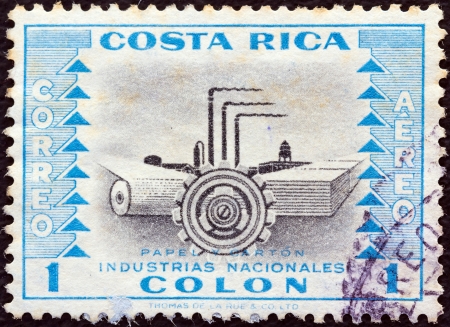 COSTA RICA - CIRCA 1954: A stamp printed in Costa Rica from the "National Industries" issue shows paper industry, circa 1954. のeditorial素材