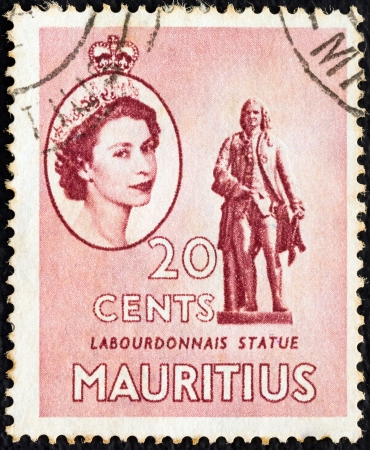 MAURITIUS - CIRCA 1953: A stamp printed in Mauritius shows Labourdonnais statue and portrait of Queen Elizabeth II, circa 1953. のeditorial素材
