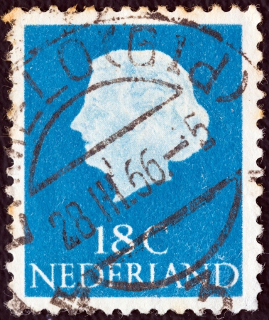 NETHERLANDS - CIRCA 1953: A stamp printed in the Netherlands shows Queen Juliana, circa 1953. のeditorial素材